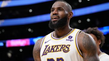 Los Angeles Lakers forward LeBron James looks toward fans after scoring during the second half of an NBA basketball game against the Denver Nuggets Saturday, March 2, 2024, in Los Angeles. (AP Photo/Mark J. Terrill)