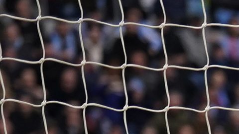 Manchester City's Erling Haaland, centre tries to score during an English Premier League soccer match between Manchester City and Manchester United at the Etihad Stadium in Manchester, England, Sunday, March 3, 2024. (AP Photo/Dave Thompson)