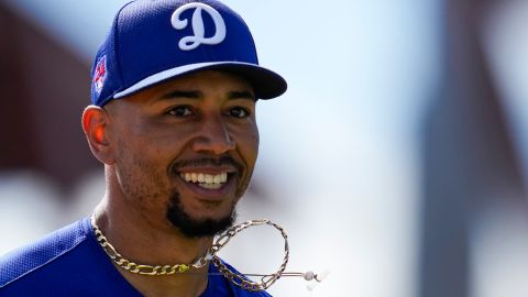 Los Angeles Dodgers second baseman Mookie Betts runs back to the dugout in the middle of the second inning of a spring training baseball game against the Colorado Rockies in Phoenix, Sunday, March 3, 2024. (AP Photo/Ashley Landis)