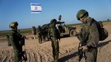 Israeli soldiers are seen near the Gaza Strip border in southern Israel, Monday, March 4, 2024. The army is battling Palestinian militants across Gaza in the war ignited by Hamas' Oct. 7 attack into Israel. (AP Photo/Ohad Zwigenberg)