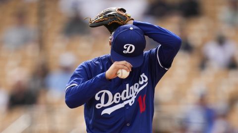 Los Angeles Dodgers starting pitcher Yoshinobu Yamamoto stands on the mound during the third inning of a spring training baseball game against the Chicago White Sox in Phoenix, Wednesday, March 6, 2024. (AP Photo/Ashley Landis)