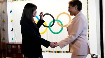 Paris Mayor Anne Hidalgo, left, speaks with Los Angeles Mayor Karen Bass during a meeting at the Paris City Hall Thursday, March 7, 2024. Bass is leading a trip to Paris to prepare for 2028 Olympic Games in Los Angeles. (AP Photo/Christophe Ena)
