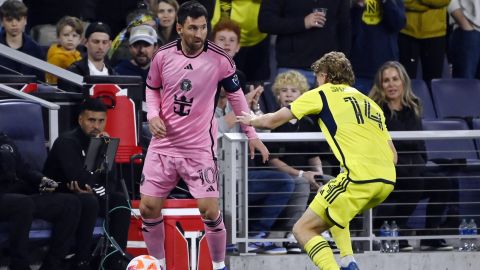 Inter Miami forward Lionel Messi (10) looks to pass the ball as Nashville SC forward Jacob Shaffelburg (14) defends during the first half of a CONCACAF Champions Cup tournament soccer match Thursday, March 7, 2024, in Nashville, Tenn. (AP Photo/Mark Zaleski)