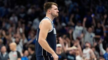 Dallas Mavericks guard Luka Doncic reacts to scoring a three pointer during the second half of an NBA basketball game against the Miami Heat in Dallas, Thursday, March 7, 2024. (AP Photo/LM Otero)