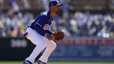 Los Angeles Dodgers shortstop Mookie Betts readies for the play in the first inning of a spring training baseball game against the Texas Rangers on Saturday, March 9, 2024, in Phoenix. (AP Photo/Carolyn Kaster)