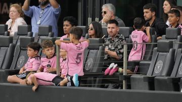 Inter Miami forward Lionel Messi, center right, sits with his family in a sideline box during the first half of an MLS soccer match against CF Montreal, Sunday, March 10, 2024, in Fort Lauderdale, Fla. (AP Photo/Rebecca Blackwell)