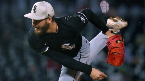 Chicago White Sox starter Dylan Cease follows through on a pitch to a Cincinnati Reds batter during the second inning of a spring training baseball game Tuesday, March 12, 2024, in Goodyear, Ariz. (AP Photo/Carolyn Kaster)