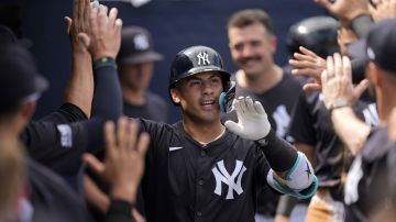 New York Yankees' Gleyber Torres celebrates after hitting a home run in the fifth inning of a spring training baseball game against the Boston Red Sox Wednesday, March 13, 2024, in Tampa, Fla. (AP Photo/Charlie Neibergall)