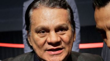 FILE - Boxing great Roberto Duran attends a news conference in New York, on Jan. 14, 2015. The family of boxing great Roberto Duran says he is receiving medical care for a heart problem. The 72-year-old Panamanian was a champion in four different weight classes. His family says he “has suffered a health complication due to an atrioventricular blockade." WBC president Mauricio Sulaiman says in a social media post that Duran is being treated in a hospital in Panama. (AP Photo/Seth Wenig)