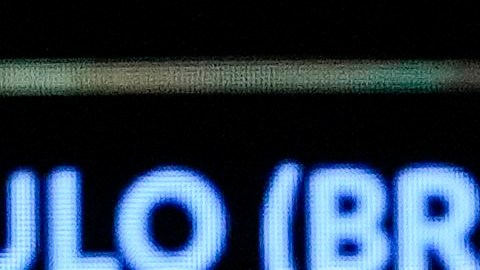 Competitions Director of Conmebol Frederico Nantes, center, holds a paper with the name of Argentina's Rosario Central during the Copa Libertadores draw in Luque, Paraguay, Monday, March 18, 2024. (AP Photo/Jorge Saenz)