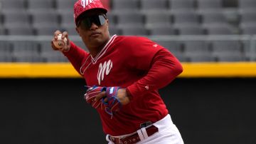 Diablos of Mexico's second base Robinson Cano throws a ball during a practice session ahead of the team's upcoming friendly baseball games against the New York Yankees, at the Alfredo Harp Helú stadium in Mexico City, Tuesday, March 19, 2024. (AP Photo/Fernando Llano)