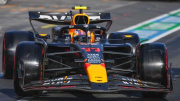 Red Bull driver Sergio Perez of Mexico steers his car out of pit lane during the qualifying session for the Australian Formula One Grand Prix at Albert Park, in Melbourne, Australia, Saturday, March 23, 2024. (AP Photo/Scott Barbour,Pool)