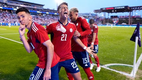 Costa Rica midfielder Jefferson Brenes, from left, Alvaro Zamora (21), Francisco Calvo (15) and Joseph Mora (8) are pelted with drinks and trash after celebrating a Brenes goal in the second half of a CONCACAF Nations League Play-In soccer match against Honduras, Saturday, March 23, 2024, in Frisco, Texas. (AP Photo/Julio Cortez)