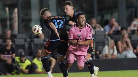 New York City FC defender Strahinja Tanasijević (12) and midfielder Hannes Wolf take over the ball from Inter Miami forward Luis Suárez (9) during the first half of an MLS soccer match, Saturday, March 30, 2024, in Fort Lauderdale, Fla. (AP Photo/Marta Lavandier)