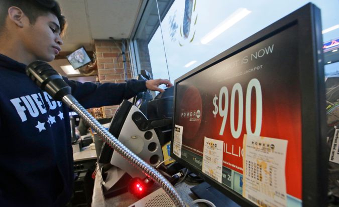 A Powerball lottery ticket is printed at a gas station in Dallas, Saturday, Jan. 9, 2016. Ticket sales for the multi-state Powerball lottery soared Saturday in the largest jackpot in U.S. history which grew to $900 million just hours before Saturday night's drawing. (AP Photo/LM Otero)