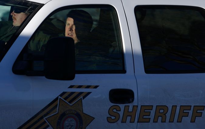 San Bernardino County Sheriff's officers leave the command post to search for former Los Angeles police officer Christopher Dorner in Big Bear Lake, Calif, Sunday, Feb. 10, 2013. The hunt for the former Los Angeles police officer suspected in three killings entered a fourth day in snow-covered mountains on Sunday, a day after the police chief ordered a review of the disciplinary case that led to the fugitive's firing and new details emerged of the evidence he left behind. (AP Photo/Jae C. Hong)