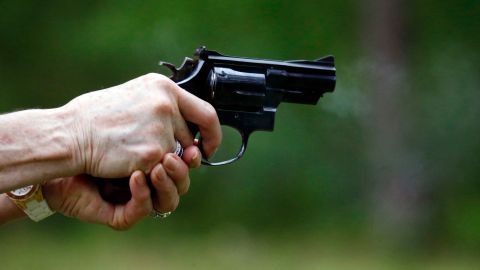 In this April 30, 2016 photograph, a participant properly holds and discharges a revolver during the live fire portion of a enhanced concealed carry class sponsored by Crestview Baptist Church for members and area residents in Petal, Miss. The 20 participants received hands on assistance during a practical shooting exercise, a thorough review on the fundamentals of safe handling of firearms in addition to a review of the basic and enhanced Mississippi Concealed Carry laws. (AP Photo/Rogelio V. Solis)