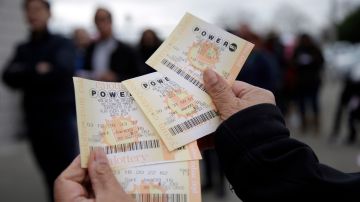 Powerball tickets are shown Saturday, Jan. 9, 2016, in San Lorenzo, Calif. Ticket sales for the multi-state Powerball lottery soared Saturday as people dreamed of winning the largest jackpot in U.S. history, which grew by $100 million to hit $900 million just hours before Saturday night's drawing. (AP Photo/Marcio Jose Sanchez)