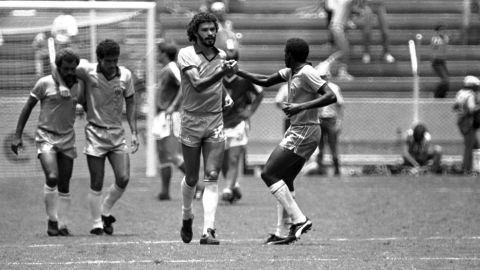 Brazils Socrates, centre, is congratulated by Josimar, after scoring the first goal by penalty kick during the World Cup game against Poland, on Monday, June 16, 1986 in Guadalajara, Mexico. At left are team mates Alemao and Careca. Brazil defeated Poland 4-0 in this second round match. (AP Photo)