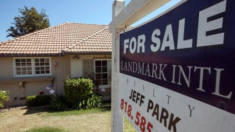 FILE - In this Tuesday, July 17, 2012 file photo, a single family home is offered for sale in the Hollywood area of Los Angeles. Freddie Mac reports on mortgage rates for the third week in August on Thursday, Aug. 22, 2013. (AP Photo/Damian Dovarganes, File)