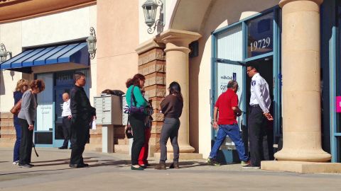 Los Angeles residents wait in line outside a Southern California Gas Co. office set up to handle claims by people affected by a 15-week-old gas leak in the Proter Ranch neighborhood of Los Angeles Friday, Feb. 5, 2016. With a possible end in sight to a massive leak, anxious residents displaced from Porter Ranch and nearby communities are skeptical a fix is near and worry they may be forced to return too soon to unhealthy homes.(AP Photo/Brian Melley)