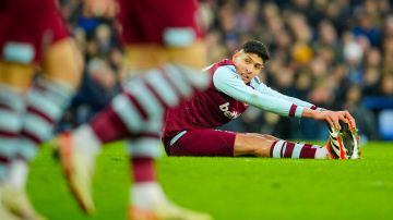 West Ham's Edson Alvarez sits on the pitch during the English Premier League soccer match between Everton and West Ham at the Goodison Park stadium in Liverpool, England, Saturday, March 2, 2024. (AP Photo/Jon Super)
