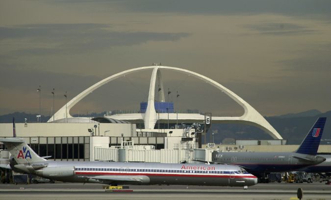 The Encounter restaurant sits atop the giant arches of the Theme building overlooking a terminal at the Los Angeles International Airport Wednesday, Nov. 28, 2001. Closed since the terrorist attacks, the signature restaurant at LAX reopened Wednesday. (AP Photo/Nick Ut)