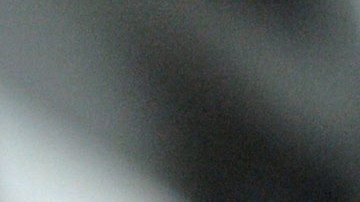 A man, detained for illegal border crossing, holds a bar in the detention center of the Hungarian Border Guard in Nyirbator, Hungary, near the Ukrainian border (260 km east of Budapest) April 12, 2007. ungary is prepared to reinforce its non-EU borders and will join the Schengen Agreement and its Information System (SIS), a central database, at the beginning of 2008. The Schengen system is an agreement among European states which allows the abolition of systematic border controls between the participating countries while they guard the external borders heavily. (AP Photo/Bela Szandelszky)