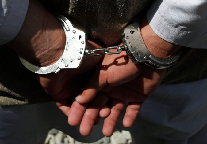 One of five alleged suicide bomber is handcuffed as they are shown to the media at the Afghan National Police crisis unit's headquarters in Kabul, Afghanistan on Thursday, April 8, 2010. Afghan police arrested the five would-be suicide bombers Thursday in Kabul _ the largest suicide bomb team ever apprehended in the capital, officials said. (AP Photo/Musadeq Sadeq)