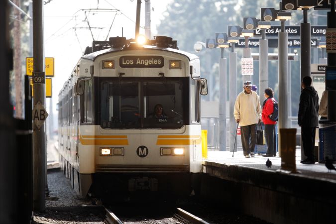 In this photo taken on on Thursday, Dec. 23, 2010, a Blue Line light rail train is seen in Los Angeles. Responding to accidents on the track has become a regular part of patrolling the 22-mile Blue Line. In just 20 years of operation, it has been linked to 101 fatalities, 23 of them resulting from suicides and the rest from trains clashing with pedestrians and motorists as they pass through some of the densest and poorest neighborhoods of South Los Angeles. (AP Photo/Damian Dovarganes)