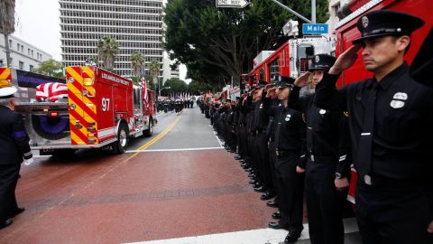 A fire truck carrying the remains of fallen Los Angeles Firefighter Glenn Allen passes in review outside the Cathedral of Our Lady of the Angels Friday, Feb 25, 2011 in Los Angeles. Allen was fatally injured last week while battling a blaze in a Hollywood Hills mansion. (AP Photo/Nick Ut)