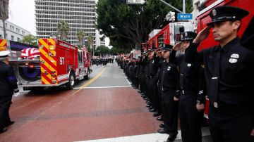 A fire truck carrying the remains of fallen Los Angeles Firefighter Glenn Allen passes in review outside the Cathedral of Our Lady of the Angels Friday, Feb 25, 2011 in Los Angeles. Allen was fatally injured last week while battling a blaze in a Hollywood Hills mansion. (AP Photo/Nick Ut)