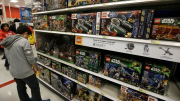 A man looks at Star Wars Lego toys displayed at a Target Store in Colma, Calif., Thursday, Nov. 28, 2013. Instead of waiting for Black Friday, which is typically the year's biggest shopping day, more than a dozen major retailers are opening on Thanksgiving day this year. (AP Photo/Jeff Chiu)