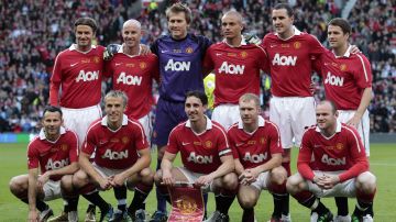 FILE - This is a Tuesday May 24, 2011 file photo of the Manchester United team including former players lines up for a friendly football match against Juventus at Old Trafford Stadium, Manchester, England. Back left to right are David Beckham, Nicky Butt, Tomasz Kuszczak, Wes Brown, John O'Shea and Michael Owen. Front Left to right are Ryan Giggs, Phil Neville, Gary Neville, Paul Scholes and Wayne Rooney. In 2014 Gary and Phil Neville, Ryan Giggs, Paul Scholes and Nicky Butt bought a 50 percent stake in non-league side Salford City, which is located less than 8 kilometers from Uniteds famed Old Trafford stadium and was playing at the time in Englands eighth tier. (AP Photo/Jon Super)