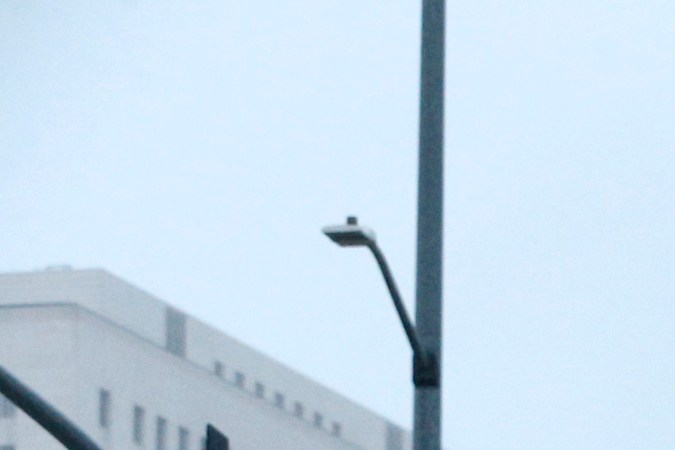 A pedestrian walks along a soggy city street in downtown Los Angeles on Monday, Oct. 17, 2016. Motorists are warned of slick roads as a weak cold front brings rain to parts of Southern California. (AP Photo/Nick Ut)