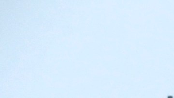 A pedestrian walks along a soggy city street in downtown Los Angeles on Monday, Oct. 17, 2016. Motorists are warned of slick roads as a weak cold front brings rain to parts of Southern California. (AP Photo/Nick Ut)