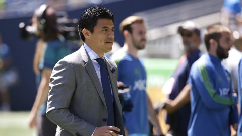 Seattle Sounders assistant coach Gonzalo Pineda, who was filling in for coach Brian Schmetzer, walks on the pitch before the team's exhibition soccer match against Eintracht Frankfurt, Saturday, July 8, 2017, in Seattle. (AP Photo/Ted S. Warren)