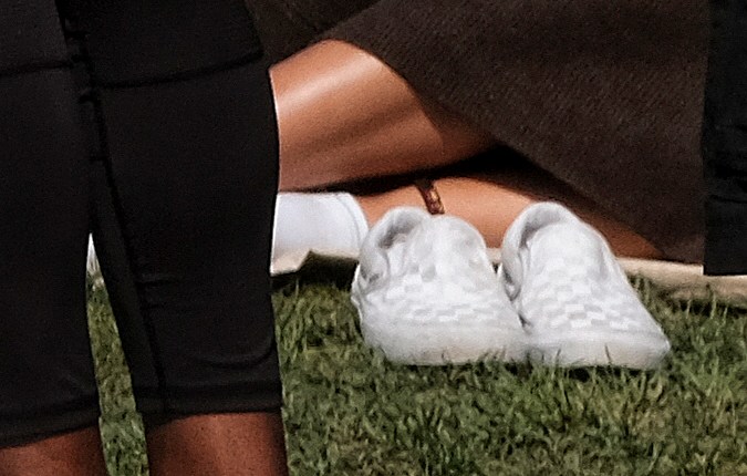 People wearing protective glasses watch the solar eclipse at the Griffith Observatory in Los Angeles Monday, Aug. 21, 2017. (AP Photo/Richard Vogel)