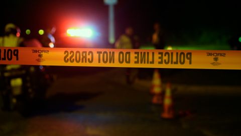 Police continue to restrict access to the neighborhood at the site of Sunday's explosion, early Monday, March 19, 2018, in Austin, Texas. Multiple people were injured in the explosion Sunday night, and police warned nearby residents to remain indoors overnight as investigators looked for possible links to other package bombings elsewhere in the city this month. (AP Photo/Eric Gay)