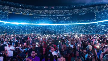 Fans hold up their mobile phones during a performance at HOT 97 Summer Jam 2018 at MetLife Stadium on Sunday, June 10, 2018, in East Rutherford, New Jersey. (Photo by Scott Roth/Invision/AP)
