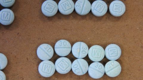 This undated photo provided by the Cuyahoga County Medical Examiners Office shows fentanyl pills. Authorities say they've arrested Ryan Gaston, a man in a Cleveland suburb after seizing more than 900 fentanyl pills marked liked tablets of the less-potent opiate oxycodone. The Cuyahoga County medical examiner said that lookalike pills were likely to blame for some of the county's 19 fentanyl-related overdose deaths in January 2016. (Cuyahoga County Medical Examiners Office via AP)