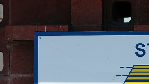 A man passes a California Department of Motor Vehicles office in the Arleta neighborhood of Los Angeles Tuesday, April 9, 2019. (AP Photo/Richard Vogel)