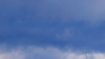 FILE - In this Nov. 29, 2019 file photo heavy storm clouds and a dusting of snow are seen in the San Gabriel mountain range behind downtown Los Angeles. Recent heavy storms in California have wiped out much of the state's abnormally dry conditions. Two months ago, the U.S. Drought Monitor categorized more 81% of the state as abnormally dry because of above-normal temperatures and a lack of precipitation six weeks into the water year that started Oct. 1, 2019. The percentage climbed to 85% as recently as last week. (AP Photo/Richard Vogel)