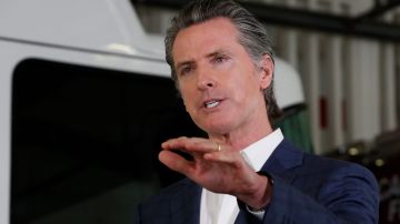 Gov. Gavin Newsom discusses California's response to the coronavirus during a news conference at the CalFire/Cameron Park Fire Station in Cameron Park, Calif., Wednesday, May 13, 2020. Newsom warned against Californians traveling unnecessarily across counties as some begin to reopen their economies at a faster pace than others. (AP Photo/Rich Pedroncelli, Pool)