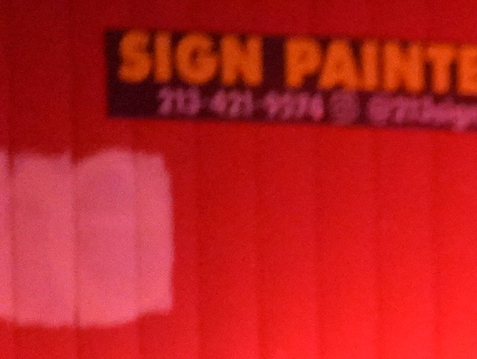 Los Angeles Fire Department paramedics move an injured person into an ambulance after a car crashed against a parked pizza oven trailer on Sunset Boulevard in Los Angeles on Saturday, Dec. 26, 2020. Two people in were transported to a hospital, according to firefighters. (AP Photo/Damian Dovarganes)