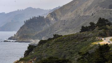 Cars drive south on Highway 1 near Big Sur, Calif., Friday, April 23, 2021. Heavy rainstorms in January 2021 caused a landslide, which closed a part of scenic Highway 1. (AP Photo/Nic Coury)