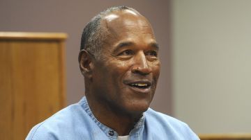 FILE - In this July 20, 2017, file photo, former NFL football star O.J. Simpson appears via video for his parole hearing at the Lovelock Correctional Center in Lovelock, Nev. The 74-year-old former football hero, acquitted California murder defendant and convicted Las Vegas armed robber was granted good behavior credits and discharged from parole effective Dec. 1, the day after a hearing before the Nevada state Board of Parole, Kim Yoko Smith, spokeswoman for the Nevada State Police, said Tuesday, Dec. 14, 2021. (Jason Bean/The Reno Gazette-Journal via AP, Pool, File)