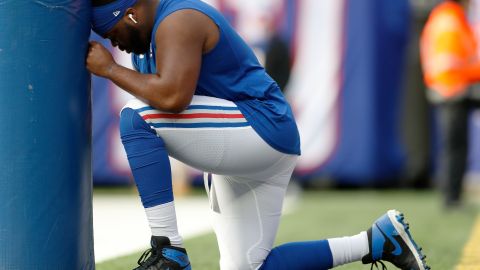 New York Giants offensive tackle Korey Cunningham (79) takes a moment before an NFL football game against the Dallas Cowboys, Sunday, Dec. 19, 2021, in East Rutherford, N.J. The Dallas Cowboys defeated the New York Giants 21-6. (AP Photo/Steve Luciano)