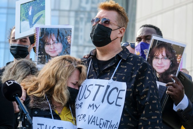 Soledad Peralta and Juan Pablo Orellana Larenas, the parents of Valentina Orellana-Peralta, attend in a news conference outside the Los Angeles Police Department headquraters in Los Angeles, Tuesday, Dec. 28, 2021. The parents of Valentina Orellana-Peralta, the 14-year-old girl killed by a stray bullet fired by an LAPD officer at a North Hollywood clothing store last week, and their attorneys held a news conference to discuss the family's demand for transparency from the Los Angeles Police Department. (AP Photo/Ringo H.W. Chiu)