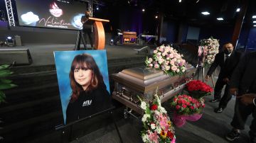 The casket containing 14-year-old Valentina Orellana-Peralta, killed on Dec. 23, 2021 by a LAPD police officer's stray bullet while shopping with her mother, is readied for her funeral at the City of Refuge Church in Gardena, Calif., Monday, Jan. 10, 2022. (AP Photo/David Swanson)